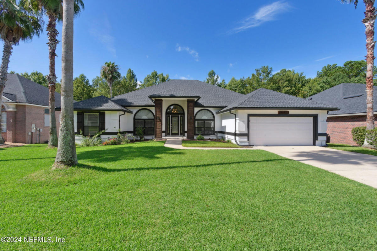 2137 BLUE HERON COVE DR, FLEMING ISLAND, FL 32003, photo 1 of 64